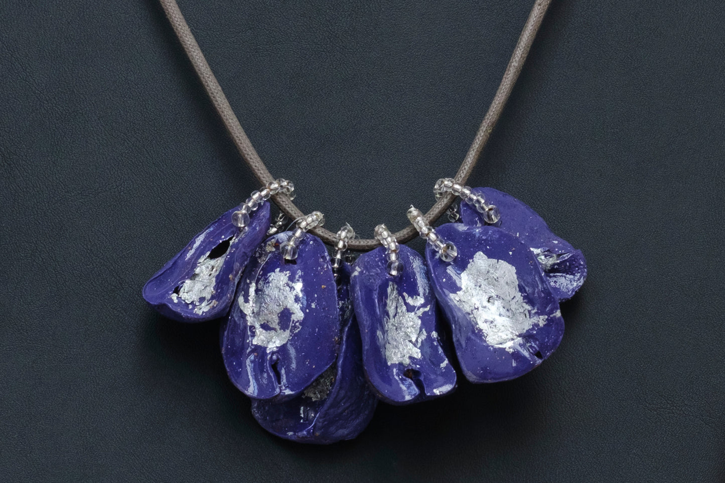 Cluster of Kolanuts Painted with Purple Paint and Silver Leaf