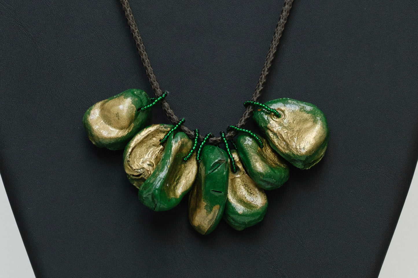 Cluster of Kolanuts Painted with Green and Gold Paint