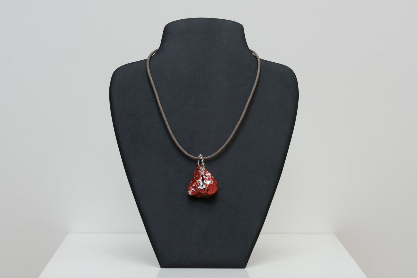 Kolanut Pendant Painted with Red Paint and Silver Leaf