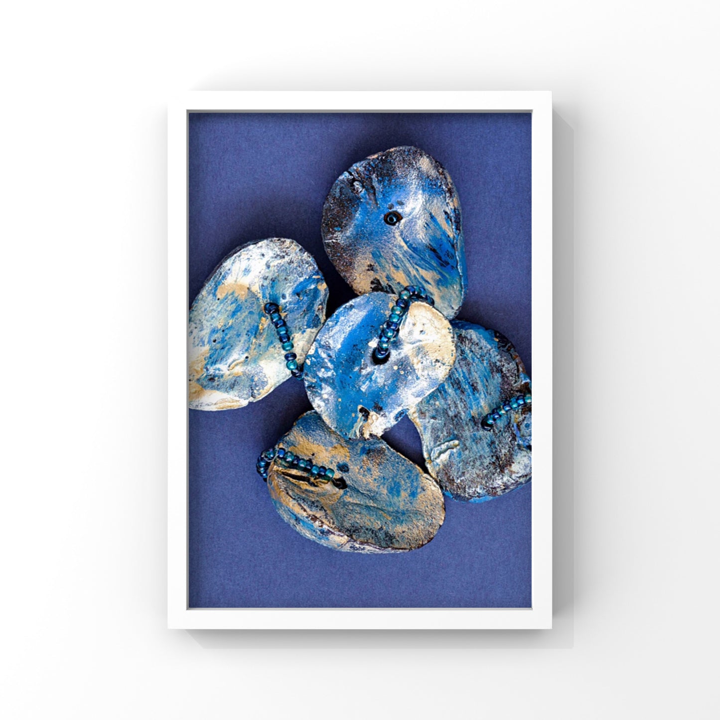 Print of a Cluster of Kolanuts Painted with Blue and Gold Paint