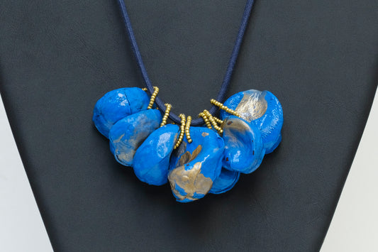 Cluster of Kolanuts Painted with Blue Paint and Gold Leaf with Blue Cord