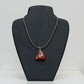 Kolanut Pendant Painted with Red Paint and Silver Leaf